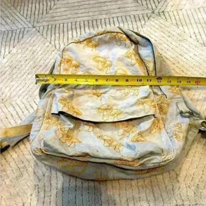 Urban outfitters embroidered gold mushroom backpack
